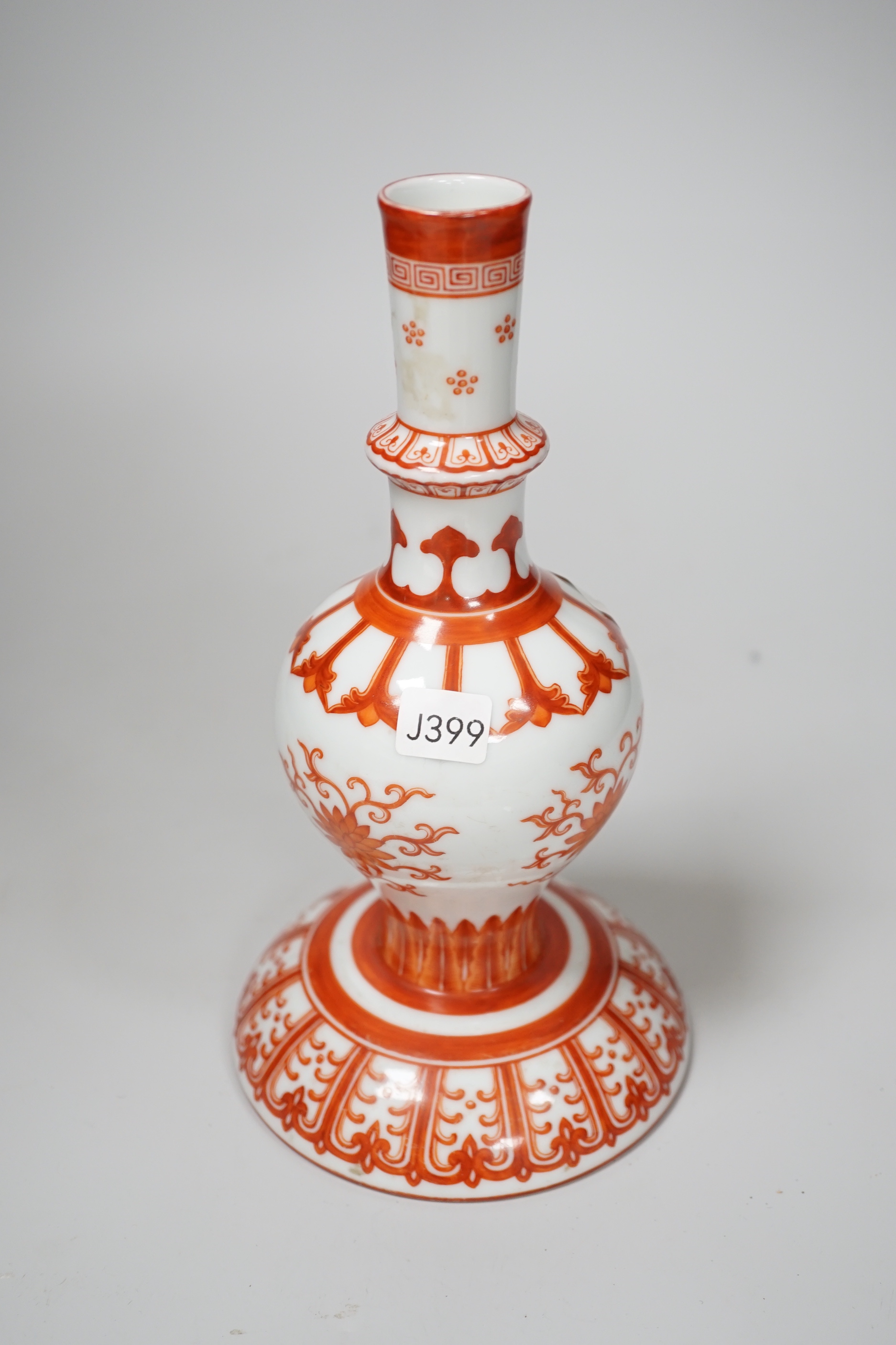 A Chinese candlestick hand painted with flowers with fitted case, 23cm high